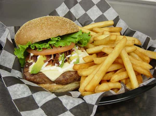 cheeseburger with lettuce, tomato and a side of french fries