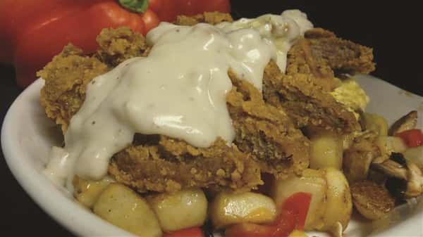 country fried steak covered in gravy