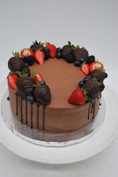 chocolate buttercream with assorted fruits and chocolate covered strawberries
