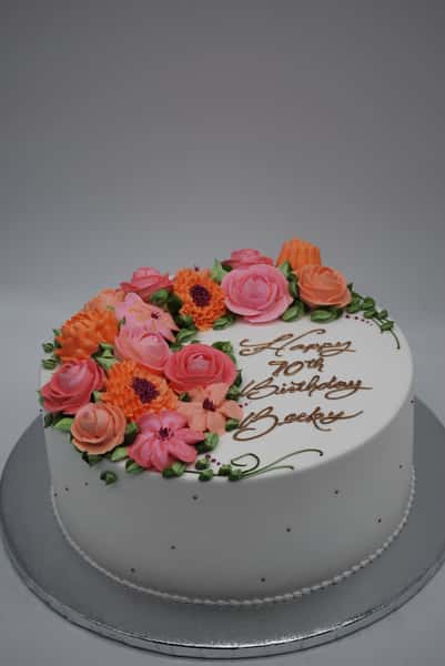 white with shades of pink buttercream roses