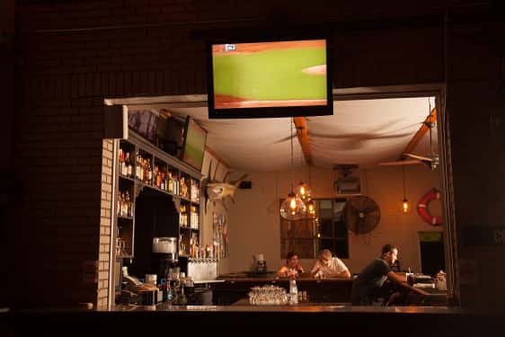 view of bar with television