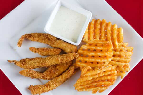 Homemade chicken strips with seasoned potatoes
