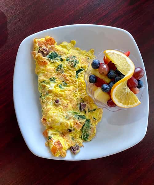 A Sunny Omelette made with Fresh Spinach, Tomatoes, Kalamata Olives, and feta Cheese.

Served with American Fries, Choice of Toast, Pancakes or Fruit