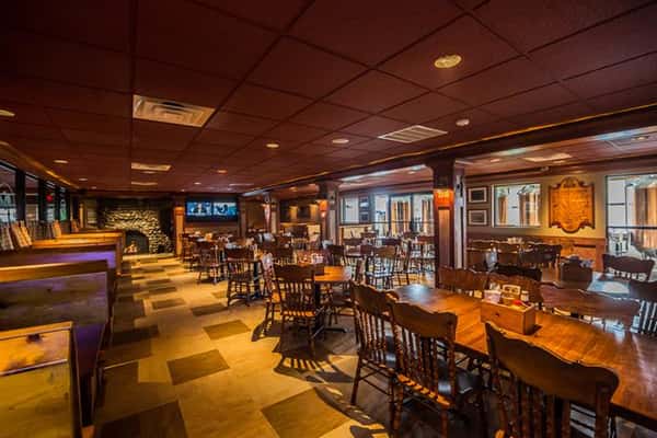 Another angle of the inside of the Brew Pub with wooden tables and chairs