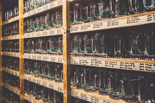 The wall of Buffalo Brew Pub beer glasses