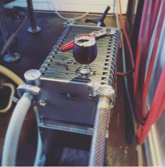 A beer glass on the fermenting equipment