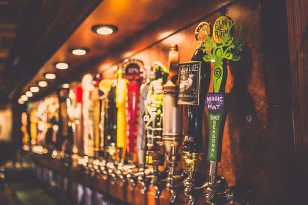 Tap beer handles under spotlights