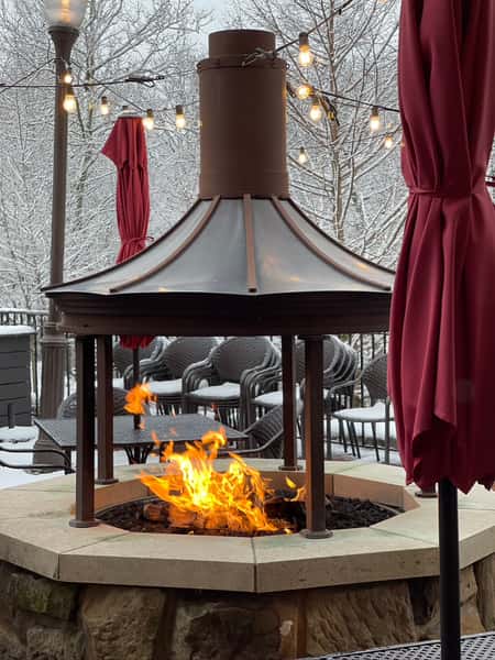 Outdoor fire pit on snowy day