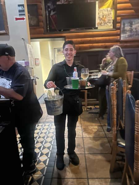 Alex, busy serving customers with his smile.  YFC Cedar  St. Patrick’s Day.