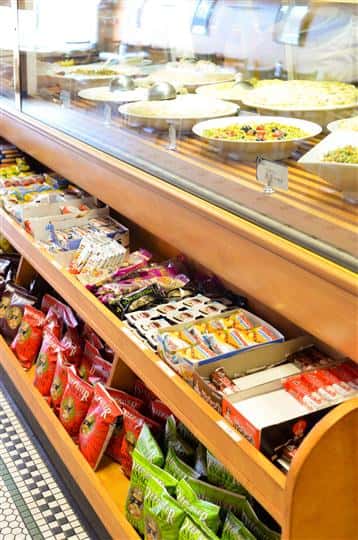shelves inside the business stocked with different goods