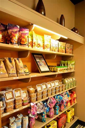 shelves inside the business stocked with different goods