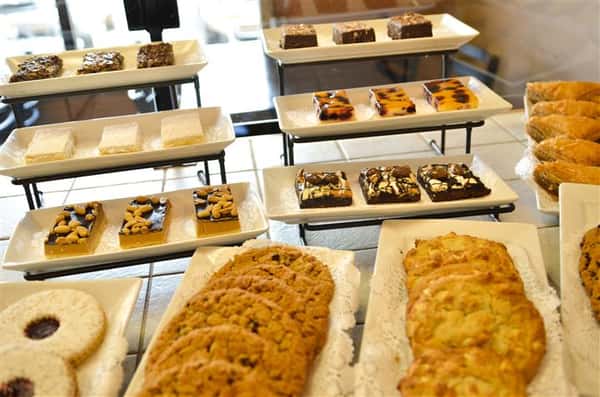bakery counter with various baked goods and pastries on display