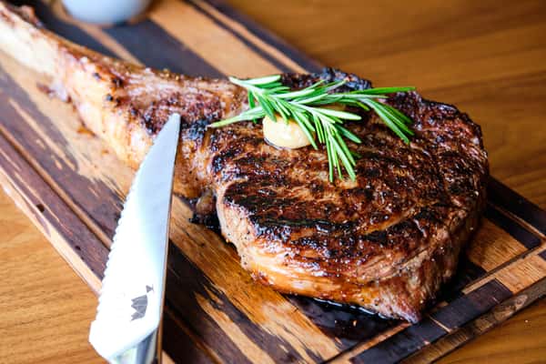 steak on wooden cutting board
