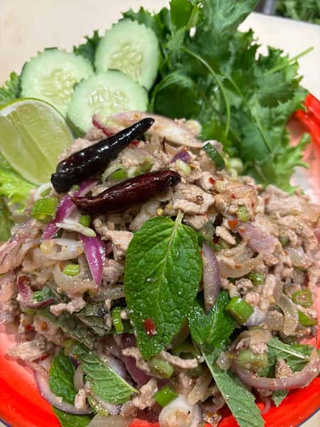 Mind Pork Mixed with Mint, Cilantro, Onion, Chili , Roasted Ground Rice, Lime juice, Fish saucePork skin serve With
