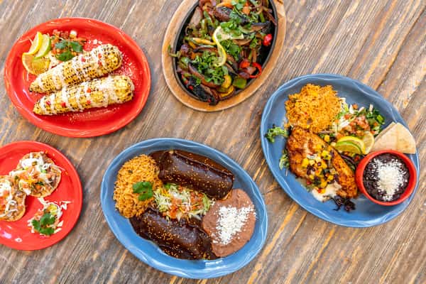 various Mexican dishes on a table