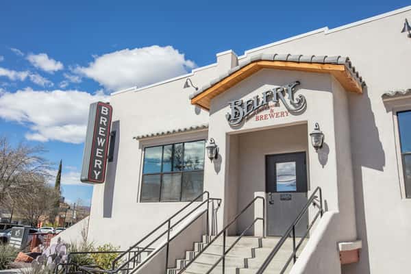 Rustic restaurant wall decor featuring mounted skull with horns in a warm, western-style interior