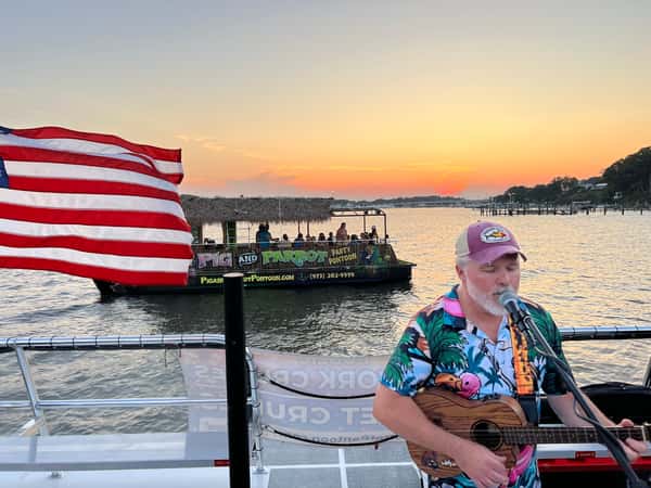 guitarist pontoon in background
