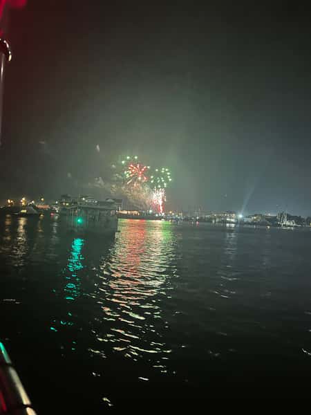 Fireworks on water over the boat