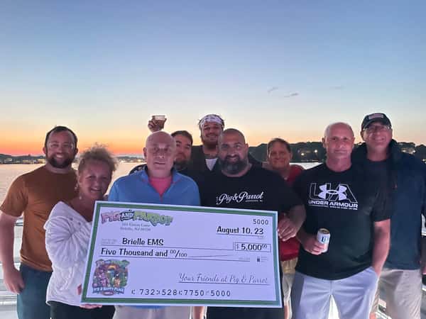 Mike donating check to Brielle EMS