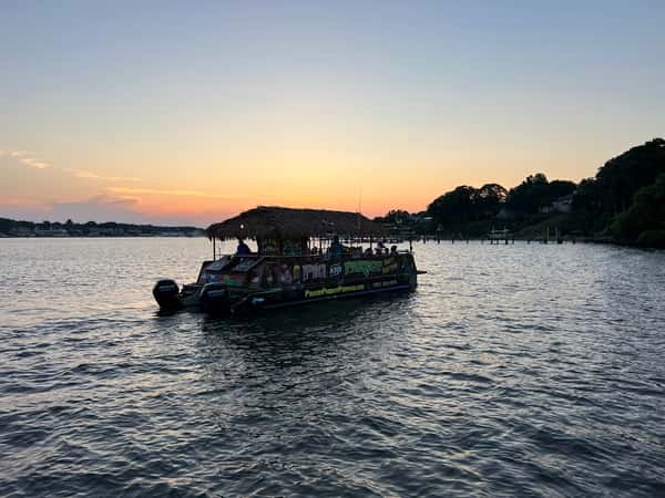 pontoon sunset in background
