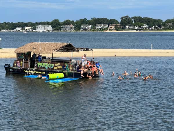 Boat docked at sand bar