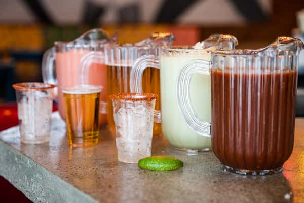 Pitchers of cocktail beverages