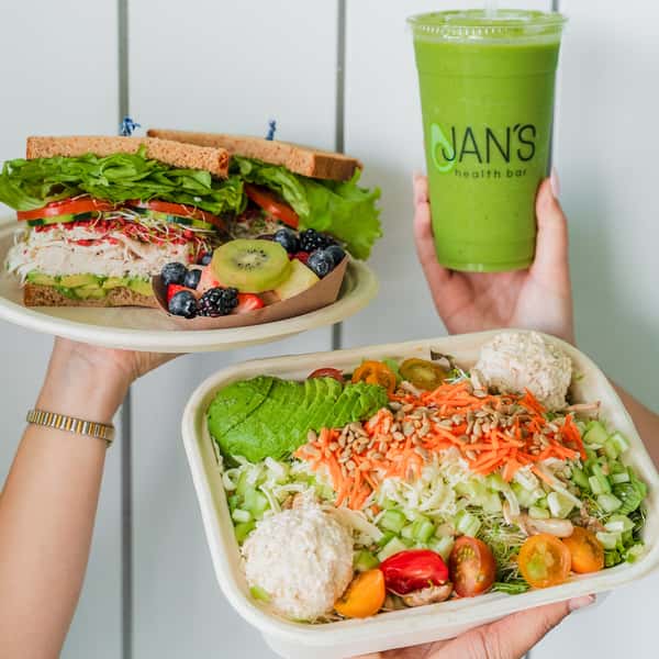 A Jan's Classic Sandwich with Turkey, a Jan's Classic Salad with Tuna Salad, and a Green Machine smoothie from Jan's Health Bar.