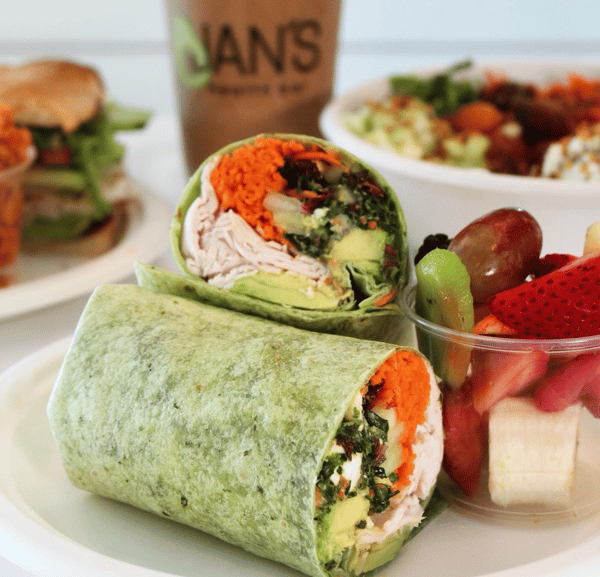 A Crunchy Kale Wrap with a side of fruit salad from Jan's Health Bar.