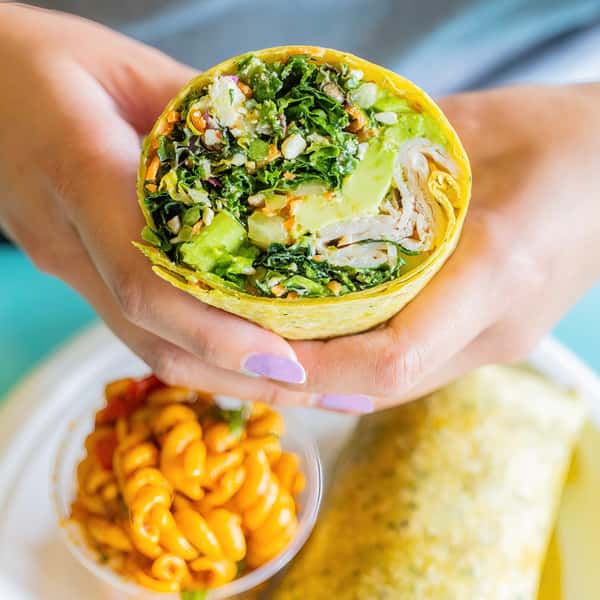 A Crunchy Kale Wrap from Jan's Health Bar with a side of pasta salad.