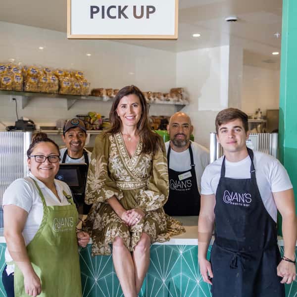 Poppy Holguin with her Jan's Health Bar employees.