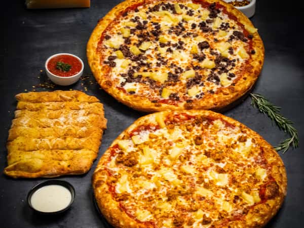 2 large pizzas with 2 toppings on each with breadsticks $24.99