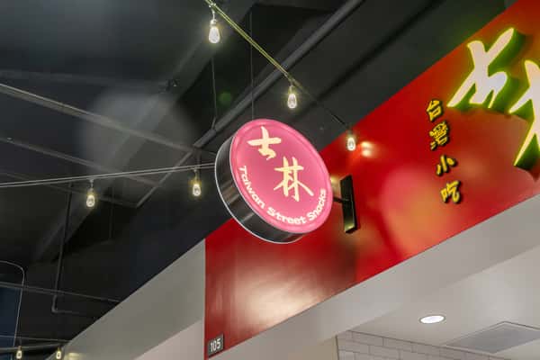 exterior sign and string lights