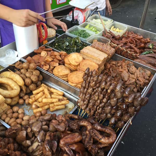 Taiwanese street food vendor at Shihlin Street Market in Taiwan, the inspiration for Shihlin Taiwan Street Snacks