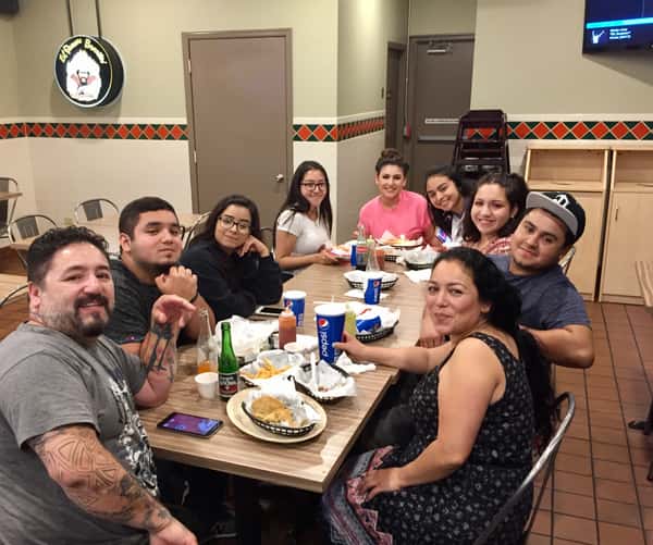 many people sitting around a table