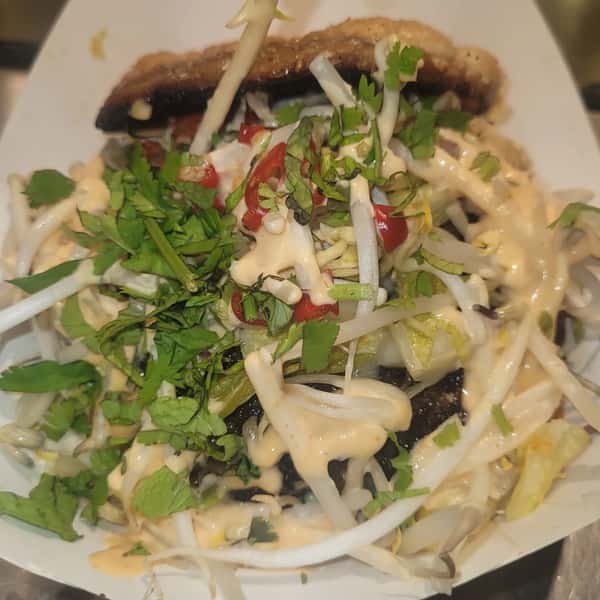 Salad with mixed greens, black beans, and creamy dressing