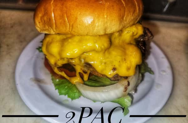 Burger called 2PAC topped with melted cheddar cheese