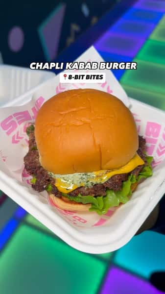 A smash burger but make it ✨Pakistani✨

Our Chapli Kabab Burger features our smash burger patty infused with onions, jalapeños, tomato, chapli kabab seasoning & it’s topped with cheese, lettuce, and mayo chutney. Available for a limited time only! 

8-BIT BITES
#8BITBITES 

📍113 Court St, Brooklyn
📍881 Lexington Ave, Brooklyn 
📍967 Bedford Ave, Brooklyn
📍77 2nd Ave, Manhattan 
📍197 7th Ave, Manhattan 
📍268 Main Street, Johnson City 
📍 17 Centereach Mall, Centereach, NY 11720