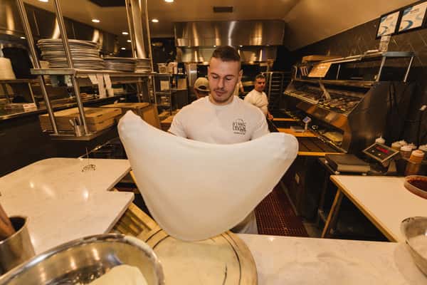 chef tossing dough