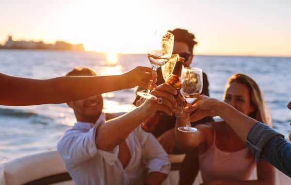 people on a boat drinking wine