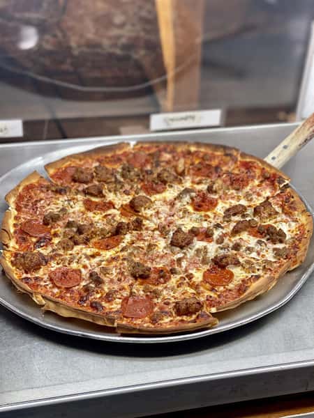 a specialty pizza with pepperoni and sausage