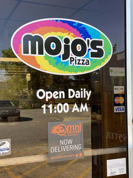 a sign on the door stating they are open daily at 11:00 AM