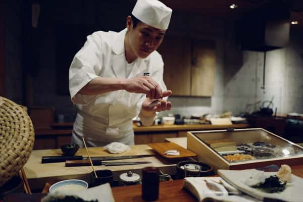 Chef preparing sushi at the kitchen counter at Sumiya restaurant
