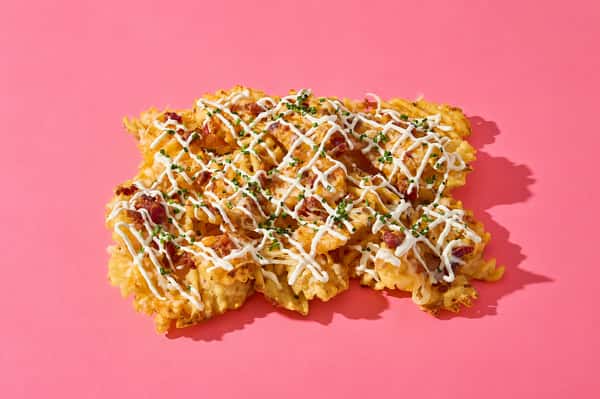 Loaded Waffle Fries with cheese, bacon and chives