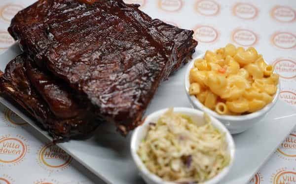 Juicy steak with fresh sides of mac and cheese