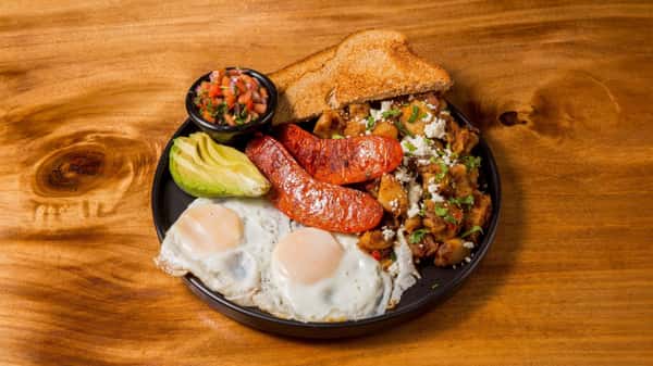 Traditional breakfast plate with sausage, eggs, potatoes, and refried beans.