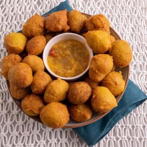 Who can resist the fluffy goodness of our Pholourie? 😋 These savory fritters served with mango chutney have won the hearts of foodies at Channa Kitchen! 🥳 Bursting with flavors from split peas, herbs, and spices, every bite is a delightful experience. Join the Pholourie fan club today! #ChannaKitchen #PholourieLove