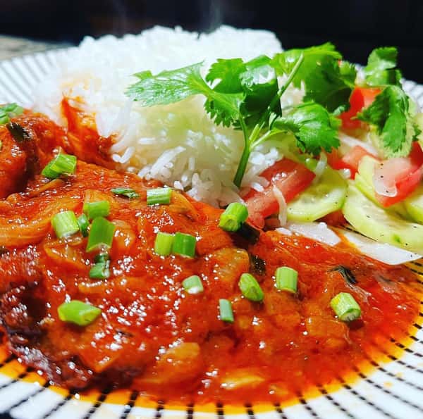 tomato based sauce with rice and veggies