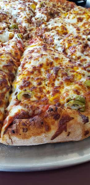 pizza with thick breading, topped with jalapenos
