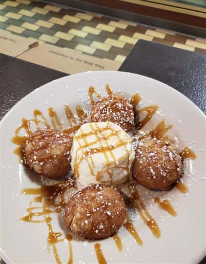 fried dessert with ice cream and caramel sauce