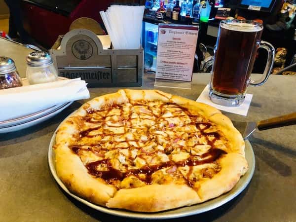 BBQ Chicken Pizza: Hand-tossed pizza with mozzarella cheese, fresh-cooked chicken, red onion and our house-made Doghouse BBQ sauce, all cooked to perfection in our stone pizza oven.